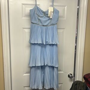 Super cute formal dress with rhinestone detail.